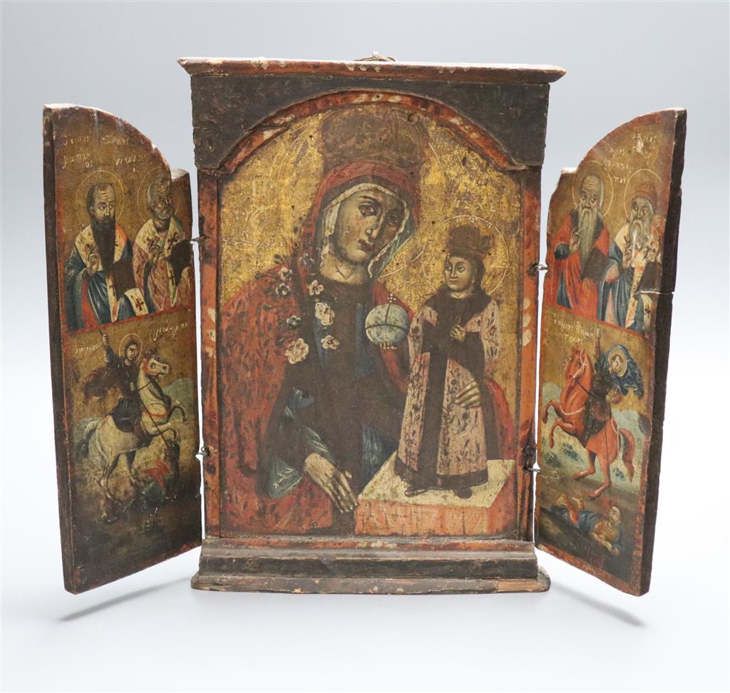 An 18th/19th century Greek/Macedonian painted and gilded wood triptych icon centred by an image of the Virgin and Child, height 35cm wi